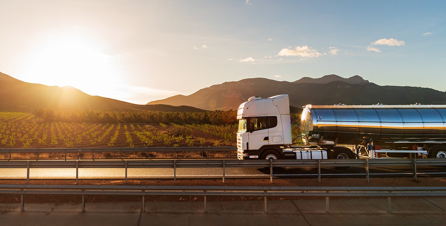 Tanker truck on the road with a sunset